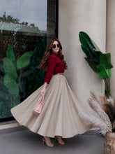 Blood red button down shirt with beige skirt