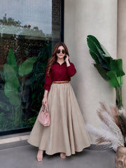 Blood red button down shirt with beige skirt
