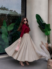 Blood red button down shirt with beige skirt